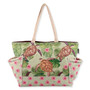 Front view of a rectangular sage green tote featuring printed sea turtles, tropical leaves, side pockets, and braided rope handles.