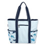 back view of a rectangular blue striped tote featuring marlin graphics, side pockets, navy canvas handles, and silver metal hardware.