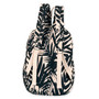 back view of a rounded black backpack featuring a light beige leaf print, zippered pocket, and silver-toned logo plate.
