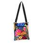 back view of a flat rectangular crossbody bag featuring a vibrant multi-colored floral and leopard print with three black zippers.