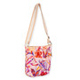 side view of a rectangular pink canvas crossbody bag featuring a vibrant tropical floral print and adjustable cream fabric strap.