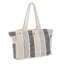 Side view of a rectangular black and cream vertical-striped woven tote bag featuring frayed fringe edges and matching fabric handles.