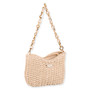 Front view of beige chunky‑woven handbag with large gold chain strap, soft textured knit body, and small metallic front logo accent.