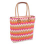 side view of colorful zigzag tote with pink, orange, white, beige pattern, tan handles with circular accents, and small top brand tag.