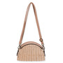 Side view of a half-moon cream wicker bag featuring a smooth tan leather top, adjustable shoulder strap, and antiqued bronze hardware.
