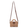 Front view of a rectangular tan woven straw bag featuring a brown leather turn-lock closure, matching strap, and bronze hardware.