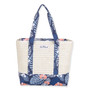 Front view of cream woven straw Sun N Sand tote featuring blue tropical monstera leaf canvas trim and matching straps.