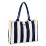 Three-quarter front view of Sun 'N' Sand navy and cream vertical striped canvas tote, navy woven straps, and side pockets.