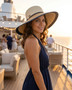 Navy floppy hat featuring Adjustable, UPF 50+.