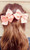 2 Pack Peach Clip-In Hair Bows with Cross Charm 2 Pack Peach Clip-In Hair Bows with Cross Charm