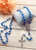 Silver Plated Crucifix and Center Blue Crystal Bead Rosary