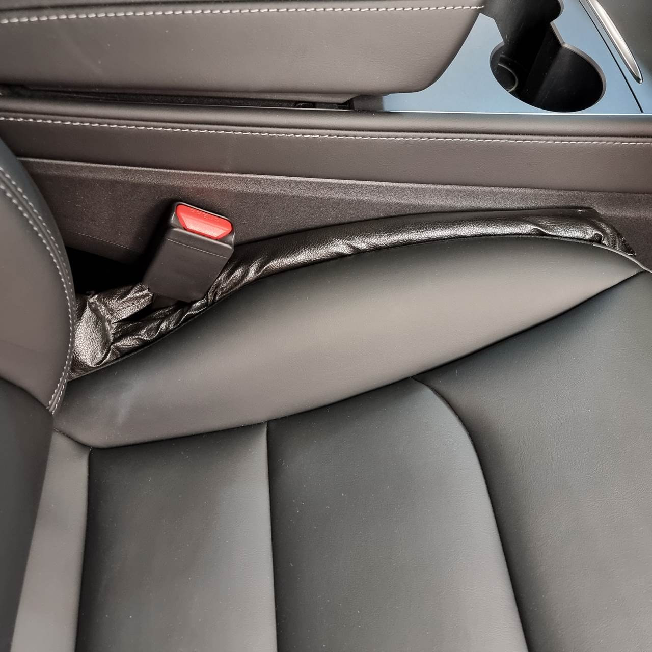 Tesla seat gap filler