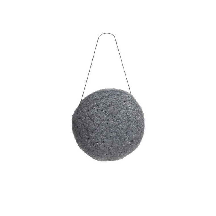 Konjac Sponge is created in Japan using the roots of the konyakku plant, a food staple for more than 1,500 years in Asian cultures. The vegetable fibers are purified and spun into a puff that is incredibly water-retentive. When used, there is a water barrier between sponge and skin which means it cleanses without scratching or irritating. The sponge is ideal for daily use, especially for those with sensitive and acne-prone skin. How to Use: For the first use, soak the sponge in warm water for 10-15 minutes until it puffs up and rehydrates. It will expand about 50% and be soft and squishy like sponge cake.

Charcoal Infusion: Charcoal helps to draw out daily impurities. When you exfoliate with the sponge, the infused charcoal will help gently bring up the build up of dirt and toxins from your pores.

Daily use: Soak briefly in warm water to rehydrate. To exfoliate, wet the sponge and make a small lather with your ONYX charcoal facial bar. You can also use the sponge alone without any cleanser. Rub in circular motions to remove dirt from the pores without scratching the skin. Your face will love it! Rinse out completely, then press between palms to remove excess water from sponge and hang to dry.

After 3 months: Sanitize the sponge or replace. If you see mold or bacteria growth, do not use the sponge. Some users have boiled it in water to sterilize it, or saturated it in water and microwaved for 20 seconds to sterilize. If you continue to squeeze and hang it to fully dry between uses, it could last for up to 6 months. If it smells funny, becomes discolored, or looks off, throw it away and do not continue using. It is a natural product and can grow mold or bacteria if not properly handled.

Storage: After each use, rinse out the sponge and gently press between palms to remove excess water. Hang up to dry between uses, with the included string hanger. Never wring out the sponge as this might damage or alter its shape. Replace after 3 to 6 months.

biodegradable | 100% plant-based | compostable | 3-6 months lifetime