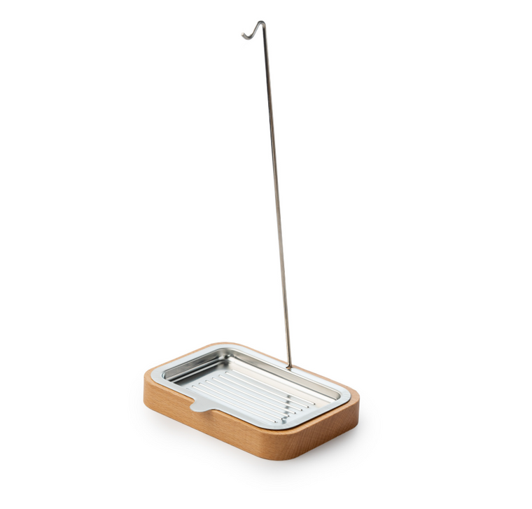 A handy stand for your dish brush. This holder allows your dish brush to dry naturally. Use the tray as a dish soap dispenser. Made with an FSC® certified beech wood base and stainless steel tray.