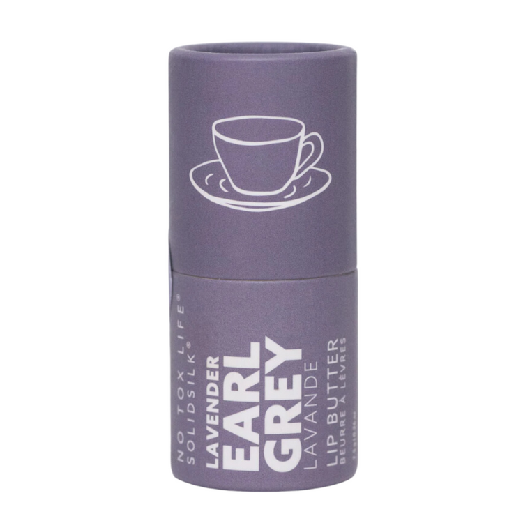 Lavender Earl Grey Lip Butter: an herbal and citrus essential oil blend, with a hint of sweet, packaged in a paperboard tube.