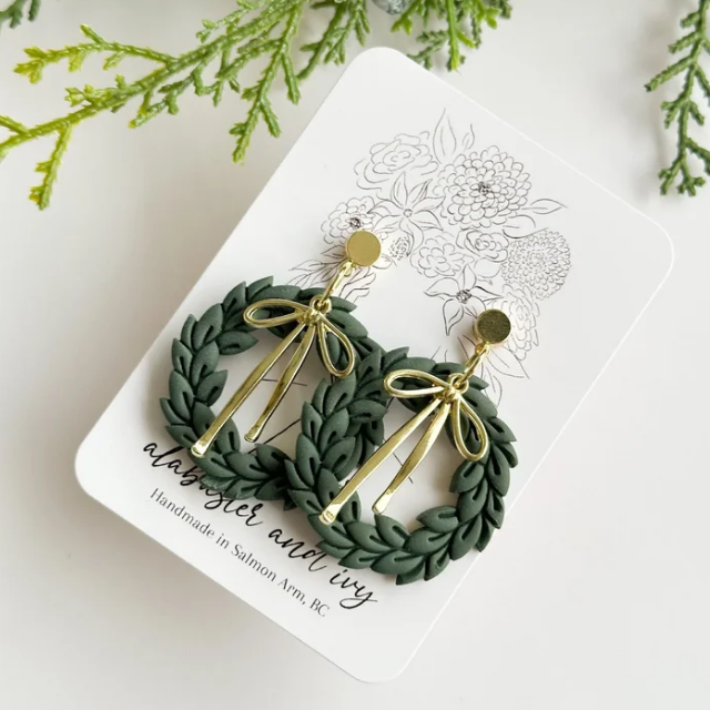 These are the perfect statement holiday earring! Hand detailed with the sweetest 18k gold plated bows.