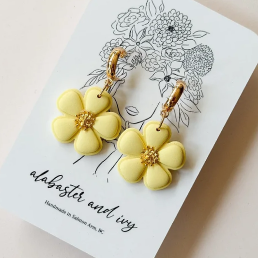 Featuring 18k gold stamen centers, these flowers are designed after popular summer blooms!
Finished with 18k gold plated huggie hoops.