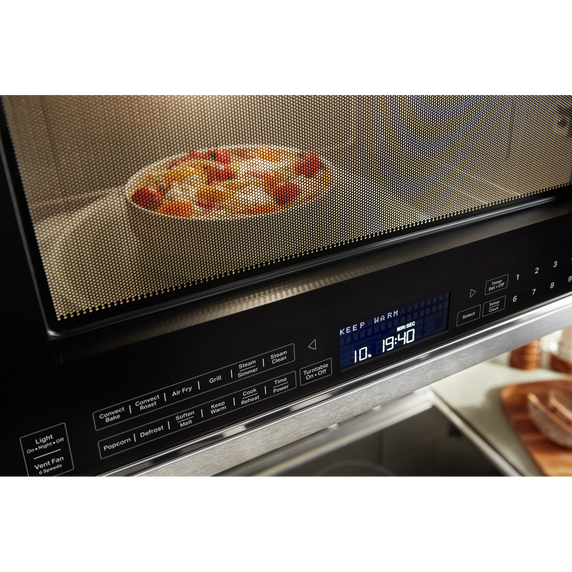 Four à micro-ondes à convection et hotte intégrée  avec mode de friture à air KitchenAid® YKMHC319LPS