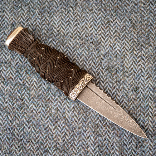 Traditional Scottish Sgian Dubh with carved Highland Oak handle, Sterling Silver fittings, Loch Ness pommel stone and patterned steel blade