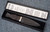 Traditional Scottish Sgian Dubh with carved Bog Oak handle, Sterling Silver fittings and Celtic Knotwork leather sheath in a black presentation box with written details of Sgian Dubh in the lid of box, including the individual serial number.