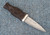 Traditional Scottish Sgian Dubh with carved Bog Oak handle, Sterling Silver fittings and patterned steel blade.