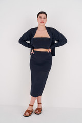 Profile view of model wearing the Oroton Stitch Detail Skirt in North Sea and 83% Viscose, 17% Polyester for Women