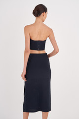 Profile view of model wearing the Oroton Stitch Detail Skirt in North Sea and 83% Viscose, 17% Polyester for Women