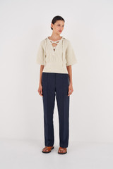 Profile view of model wearing the Oroton Pintuck Pant in North Sea and 58% Viscose, 42% Linen for Women