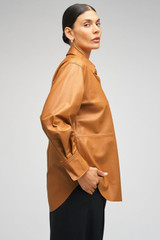 Profile view of model wearing the Oroton Leather Overshirt in Tan and 100% Leather for Women