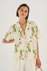 Profile view of model wearing the Oroton Field Daisy Camp Shirt in String and 100% Linen for Women