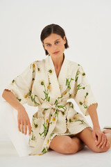 Profile view of model wearing the Oroton Field Daisy Print Robe in String and 100% Linen for Women