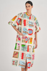 Profile view of model wearing the Oroton Ticket Print Shirt Dress in Fuchsia and 100% Silk for Women