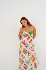 Profile view of model wearing the Oroton Ticket Print Slip Dress in Fuchsia and 100% Silk for Women