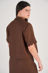 Profile view of model wearing the Oroton Cropped Scallop Camp Shirt in Dark Chocolate and 100% Linen for Women
