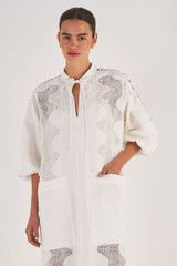 Profile view of model wearing the Oroton Geo Ric Rac Column Dress in Antique White and 100% Linen for Women
