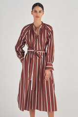 Profile view of model wearing the Oroton Long Sleeve Stripe Dress in Iced Chocolate and 100% Linen for Women