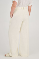 Profile view of model wearing the Oroton High Waist Pleat Pant in Soft Cream and 100% Linen for Women
