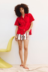 Profile view of model wearing the Oroton Capri Stripe Short in Iced Chocolate and 100% Linen for Women