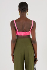 Profile view of model wearing the Oroton Satin Bralette in Candy Pink and 85% Polyester, 15% Silk for Women