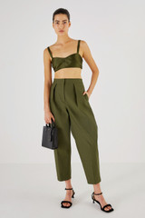 Profile view of model wearing the Oroton Satin Bralette in Khaki and 85% Polyester, 15% Silk for Women