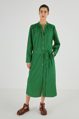 Profile view of model wearing the Oroton Stripe Shirt Dress in Kelly Green and 100% Cotton for Women