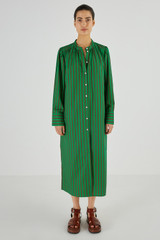 Profile view of model wearing the Oroton Stripe Shirt Dress in Kelly Green and 100% Cotton for Women