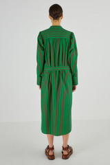 Profile view of model wearing the Oroton Stripe Shirt Dress in Kelly Green and 100% Cotton for Women