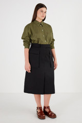 Profile view of model wearing the Oroton Tailored Midi Skirt in Black and 100% Cotton for Women