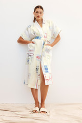 Profile view of model wearing the Oroton Patch Label Long Robe in Lemon Zest and 100% Linen for Women