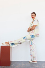 Profile view of model wearing the Oroton Patch Label Pant in Lemon Zest and 100% Linen for Women