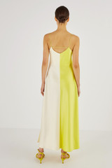 Profile view of model wearing the Oroton Fluid Satin Slip Dress in Citrine and 80% Acetate, 20% Polyester for Women