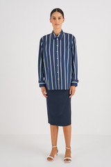 Profile view of model wearing the Oroton Long Sleeve Stripe Poplin Shirt in North Sea and 100% Cotton for Women