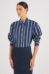 Profile view of model wearing the Oroton Long Sleeve Stripe Poplin Shirt in North Sea and 100% Cotton for Women