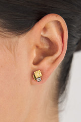 Profile view of model wearing the Oroton Leora Cluster Studs in Worn Gold/Silver/Clear and Brass base metal with precious metal plating/stone for Women